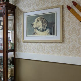 Hallway with dog portrait and memory box