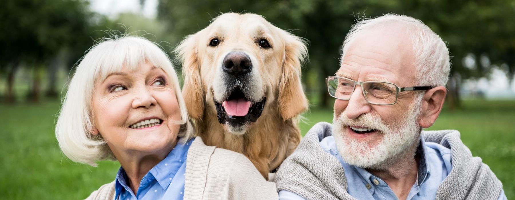 a man and woman with a dog