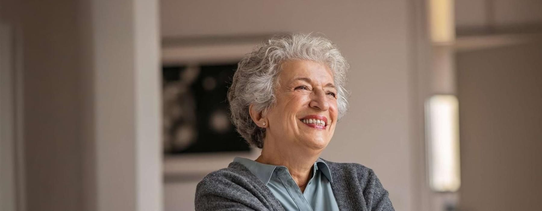 a woman smiling in a room